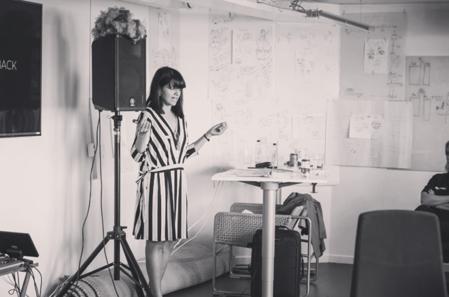 Black and white photo of Saaniya speaking at a Record Union workshop